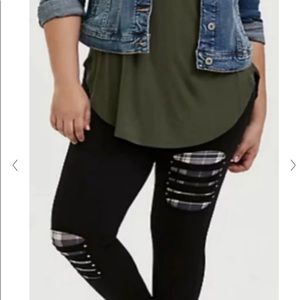 Black leggings with “slash” and plaid details